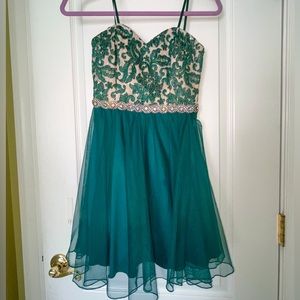 Beautiful green Jodi Kristopher dress for sale. Worn once to homecoming dance.